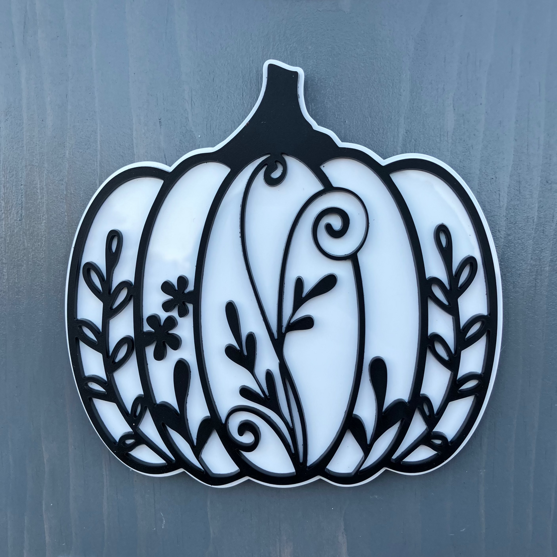 Decorative pumpkin design on a gray background